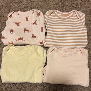 Set of Four Baby Onesies with Animal and Striped Patterns (Amazon Essentials)